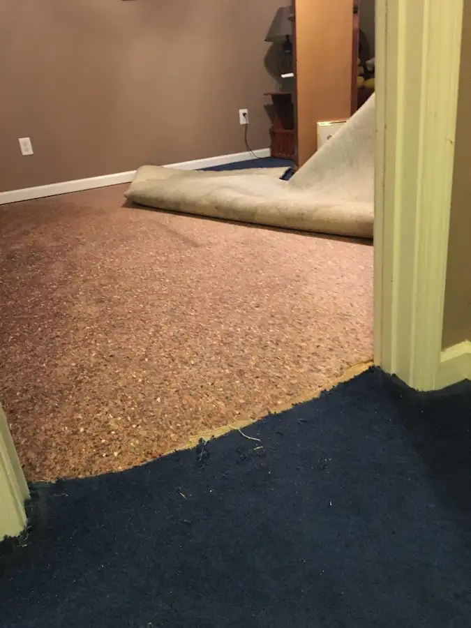Carpet pad removal revealing water damage during Drying & Dehumidification in Sapulpa